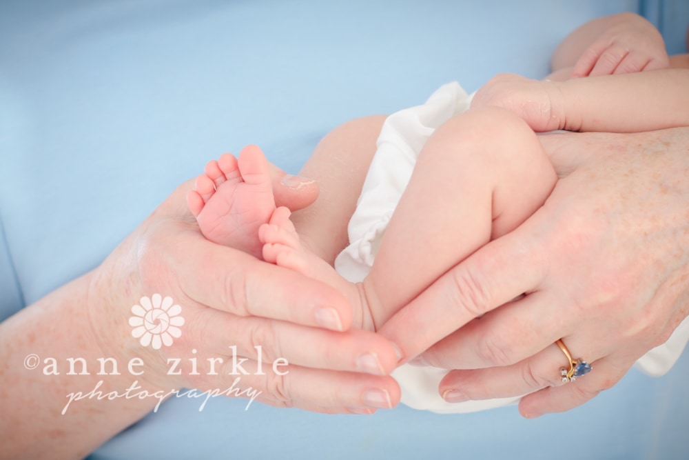 newborn feet in grandmother's hands Mooresville and Lake Norman newborn baby photographer