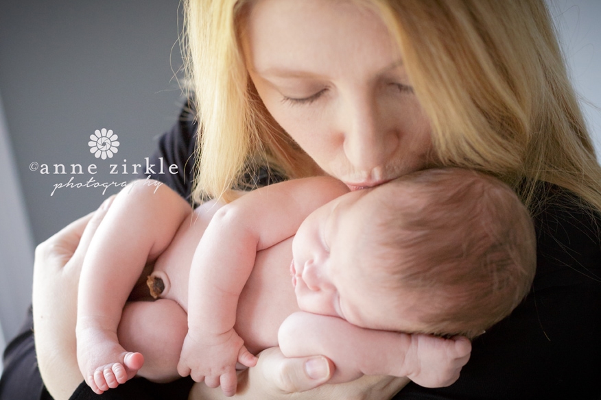 mother kissing newborn Mooresville and Lake Norman newborn baby photographer