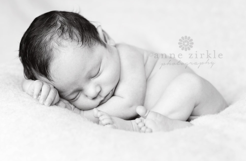 newborn baby sleeping with lots of hair Mooresville and Lake Norman newborn baby photographer