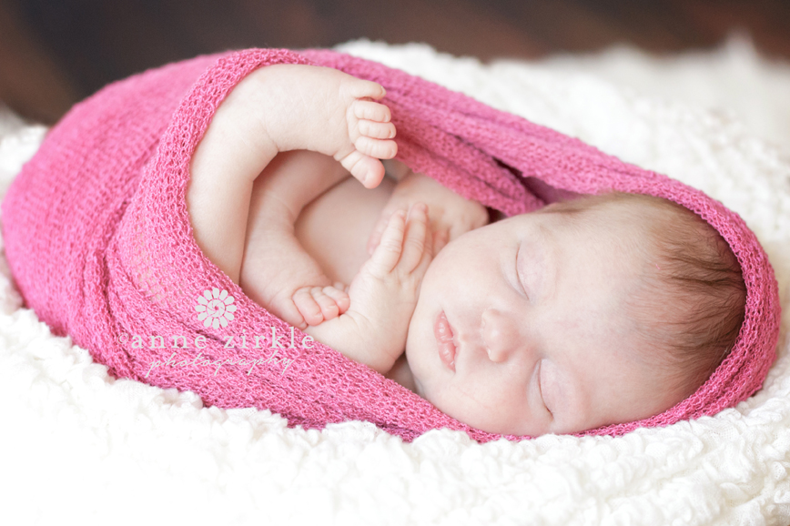 newborn girl swaddled in pink wrap Mooresville and Lake Norman newborn baby photographer