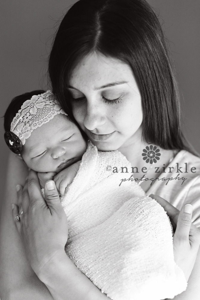 newborn girl held by mother Mooresville and Lake Norman newborn baby photographer
