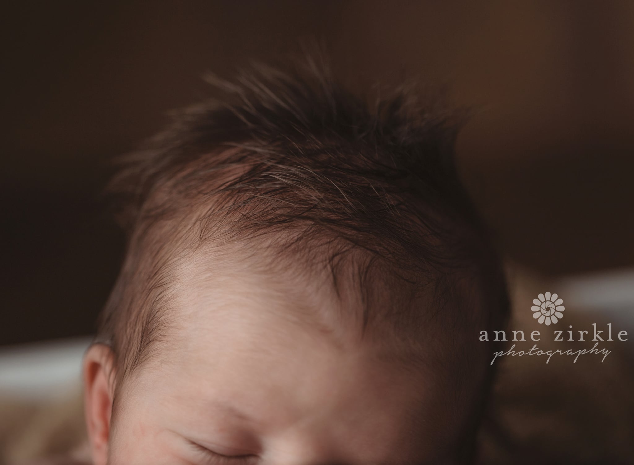 newborn with lots of hair that sticks up Mooresville and Lake Norman newborn baby photographer