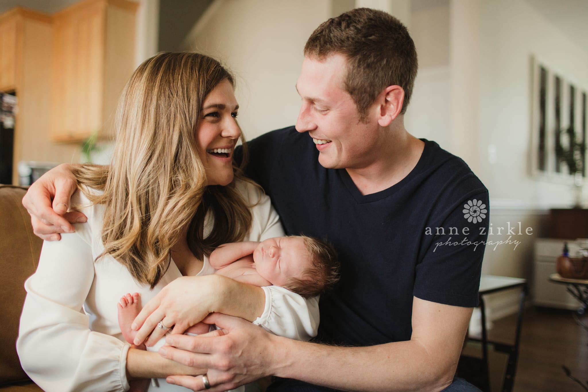 newborn with parents laughing lifestyle Mooresville and Lake Norman newborn baby photographer